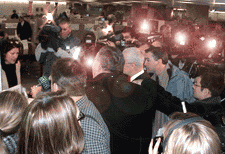 Ian Taylor and George Olds surrounded by media as they ask for a marriage licence on Feb. 14, 2002 at Toronto City Hall (Photo by equalmarriage.ca, 2003)