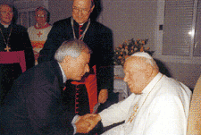 Dennis Mills bows down in obedience to the hateful policies of the Vatican (Photo from Dennis Mills' Christmas Card, 2002)